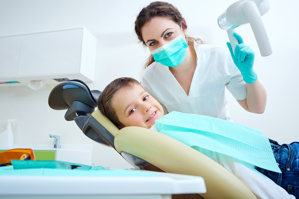 Beautiful,Kid,Boy,Smiling,In,Dentist's,Chair,The,Office,Treats